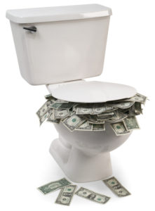 Dollarscheine die aus der Toilette herausquellen